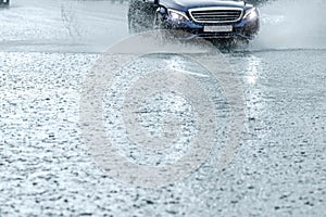 Car in motion during heavy rain