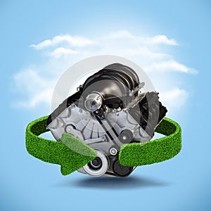 Car motor engine Concept with green arrows from the grass. Recycling concept on blue background