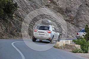 Car move along a winding mountain road