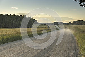 Car moving fast through countryside road