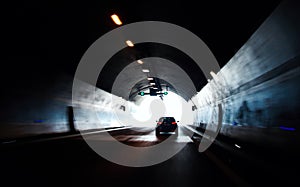 Car moving out from road tunnel