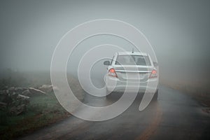 A car moving through thick fog