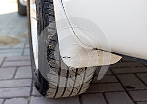 Car mudguard or mudflap of a rear wheel