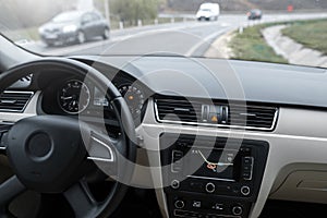 Car navigation system in modern car interior.