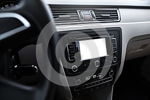 Car navigation system in modern car interior with mock up. Isolated display of multimedia.