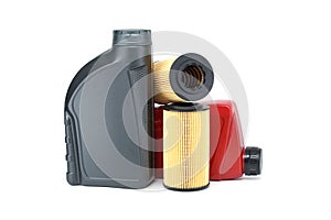 Car oil filters and motor oil cans over white