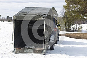 Car open trailer with awning. A car with a trailer