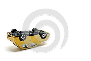 Car overturned on a white background