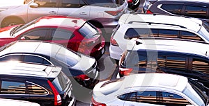 Car parked at concrete parking lot of shopping mall in holiday. Aerial view of car parking area of the mall. Automotive industry.