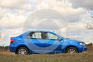 The car is parked on a country road