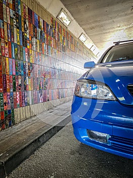 A car parked in a funky tunnel