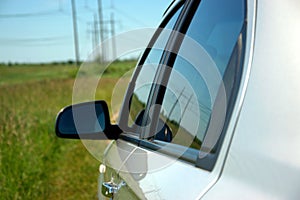 Car parked on a green meadow