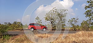 Car parked near roadside on sunny bright day