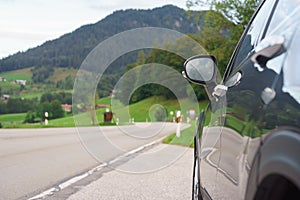 Car parked on the roadside in front of valley