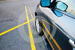 Car parked between single yellow lines