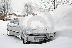 Car Parked in Snowy Driveway