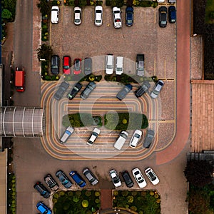 Car parking near the hotel or supermarket, view of cars in the parking lot from above