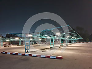 Car parking outdoor area in department store  space available at night.