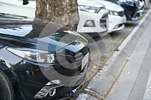 Car parking on pavement on Hanoi street, Vietnam. The city have issue lacking of car parking space.