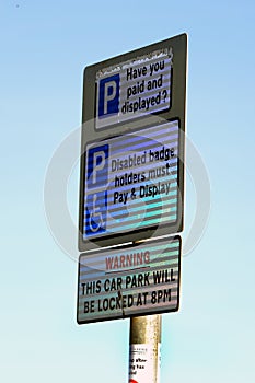 Car parking sign in day glo material.