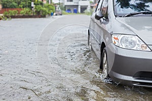 Car parking on the street of village while raining and show leve