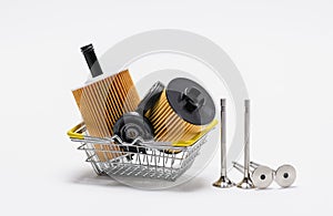 Car parts in a shopping cart on a white background.