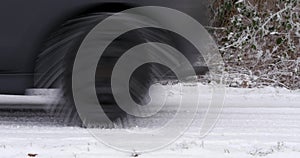 Car passing by on snowy road