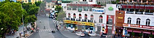 Car and people traffic in the city center of Hanoi, Vietnam. Typical cafes