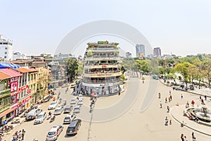 Car and people traffic in the city center. Typical cafes and restaurants