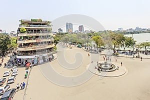 Car and people traffic in the city center. Typical cafes and restaurants