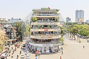 Car and people traffic in the city center. Typical cafes and restaurants