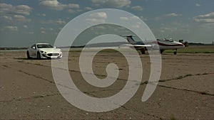 Car and plane on a runway video