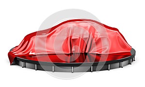 Car on the podium covered with a red satin cloth before presentation. Side view. 3d rendering.