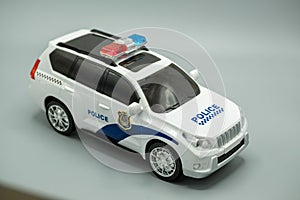 car. police toy car, isolated, on gray background, image of modren police toy car.
