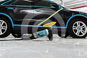 Car polish wax concept. Buffing and polishing car. Car detailing photo