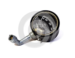 A car pressure gauge. Old gauge, manometer isolated on a white background