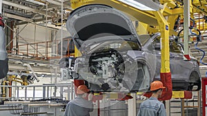 Car Production line. Assembling cars at conveyor assembly line