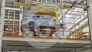 Car Production line. Assembling cars at conveyor assembly line. Modern Assembly of cars at the plant