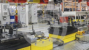 Car Production line. Assembling cars at conveyor assembly line. Modern Assembly of cars at the plant