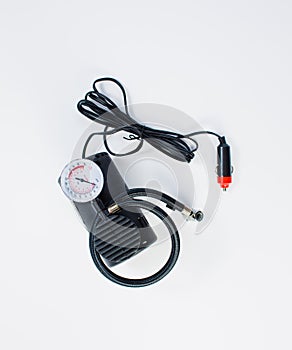 Car pump with manometer, air compressor on white background