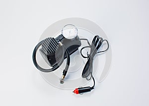 Car pump with manometer, air compressor on white background