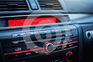 Car radio and air conditioner system. Button on dashboard in modern car panel.