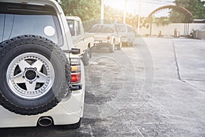 Car rear view of the car with tire on rear car on street blurred background.For automotive automobile or transport transportation