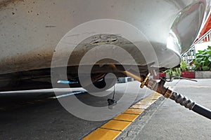 Car refuel LPG by pump nozzle at gas station