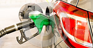 Car refuel at the petrol station. Concept photo for use of fuels gasoline, diesel, ethanol in combustion engines, air pollution