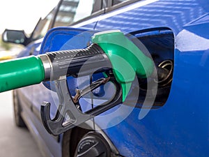 Car refueling at gas station