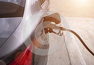 Car refueling gasoline at gasstation photo