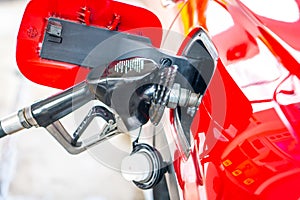 Car refueling on petrol station. Fuel pump with gasoline. Service is filling gas or diesel into tank