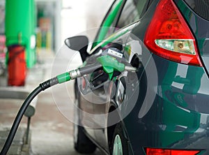 Car refueling on a petrol station in winter