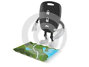 Car remote key character looking at map